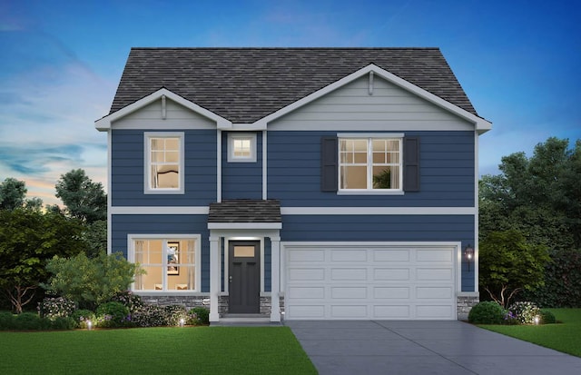 994 Garnet Ln, Montgomery, IL 60538 - traditional-style house with roof with shingles, driveway, stone siding, and a lawn