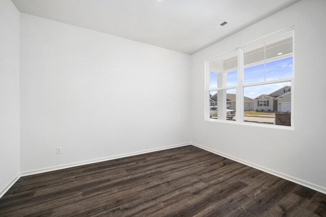 994 Garnet Ln, Montgomery, IL 60538 - unfurnished room featuring dark wood-style flooring and baseboards