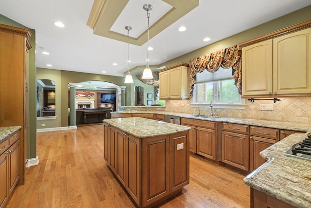 3550 Sorrel Dr, Northbrook, IL 60062 - kitchen with decorative columns, light wood finished floors, light stone countertops, decorative backsplash, and recessed lighting