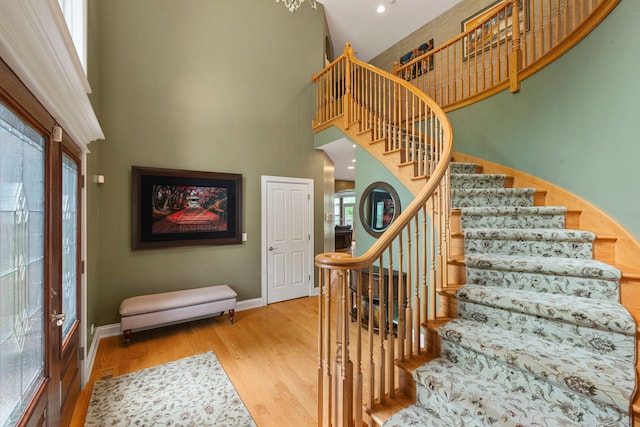 3550 Sorrel Dr, Northbrook, IL 60062 - staircase with a towering ceiling and wood finished floors
