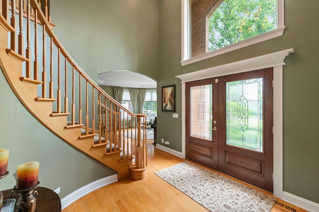 3550 Sorrel Dr, Northbrook, IL 60062 - entryway with a towering ceiling, stairway, wood finished floors, and arched walkways