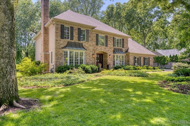 1412 Sherwood Ln, Geneva, IL 60134 - georgian-style home featuring a chimney and brick siding