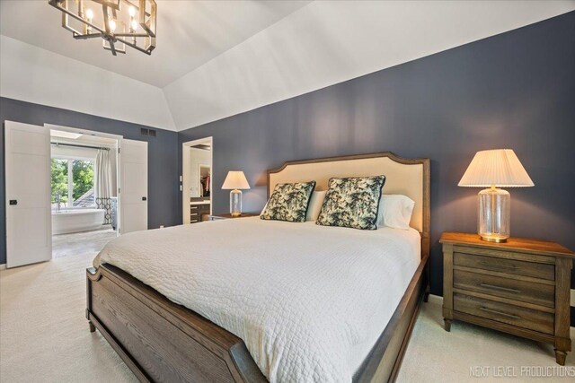 1412 Sherwood Ln, Geneva, IL 60134 - carpeted bedroom featuring a chandelier, lofted ceiling, and connected bathroom