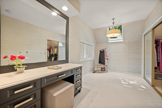 1412 Sherwood Ln, Geneva, IL 60134 - bathroom featuring vanity, a spacious closet, wallpapered walls, and plenty of natural light