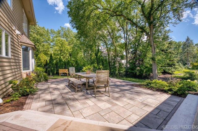 1412 Sherwood Ln, Geneva, IL 60134 - view of patio with outdoor dining space and view of wooded area
