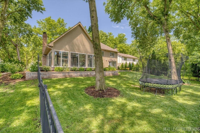 1412 Sherwood Ln, Geneva, IL 60134 - back of property featuring a trampoline and a chimney