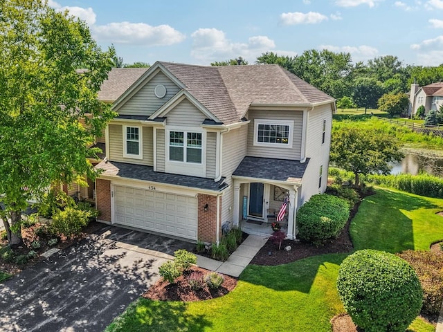 454 Blue Springs Dr, Fox Lake, IL 60020 - view of front of house featuring driveway, a front yard, an attached garage, brick siding, and roof with shingles