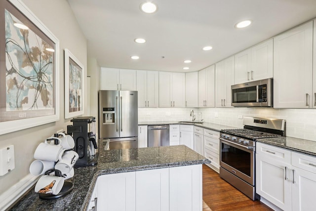 454 Blue Springs Dr, Fox Lake, IL 60020 - kitchen with stainless steel appliances, white cabinetry, decorative backsplash, and recessed lighting