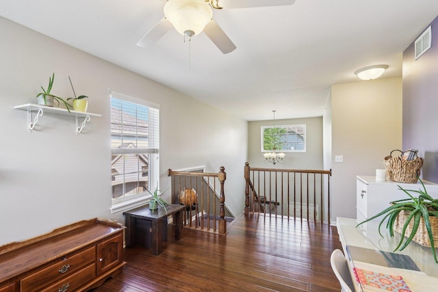 454 Blue Springs Dr, Fox Lake, IL 60020 - living area with an upstairs landing, dark wood-style floors, a chandelier, and a ceiling fan