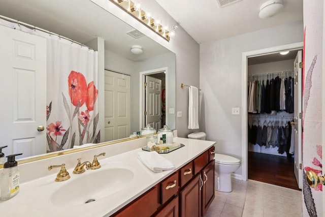 454 Blue Springs Dr, Fox Lake, IL 60020 - full bath featuring tile patterned flooring, vanity, a spacious closet, and a shower with curtain