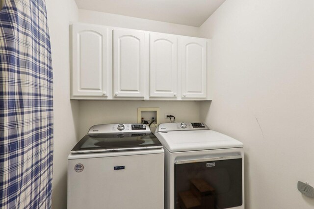 454 Blue Springs Dr, Fox Lake, IL 60020 - laundry room featuring cabinet space and separate washer and dryer
