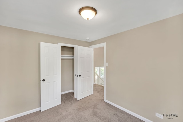2059 Downey Rd, Homewood, IL 60430 - unfurnished bedroom with light colored carpet and a closet