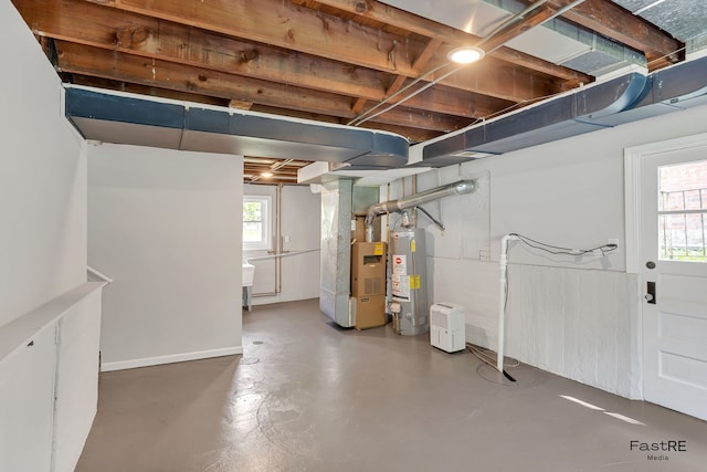 2059 Downey Rd, Homewood, IL 60430 - basement with gas water heater, healthy amount of natural light, and heating unit
