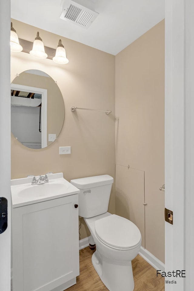 2059 Downey Rd, Homewood, IL 60430 - half bathroom featuring wood finished floors and vanity