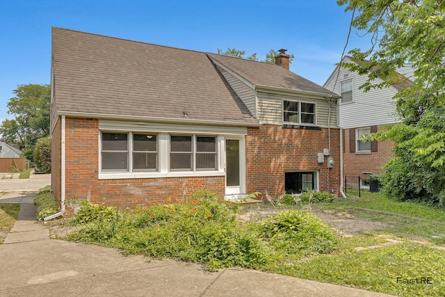 2059 Downey Rd, Homewood, IL 60430 - view of side of home with brick siding, a chimney, and roof with shingles