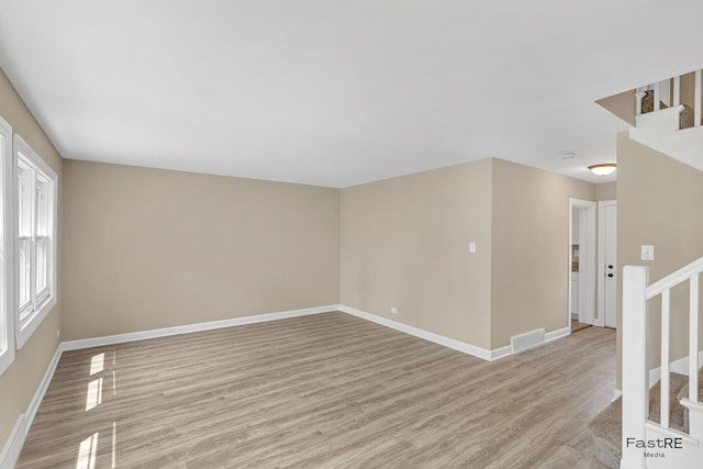 2059 Downey Rd, Homewood, IL 60430 - unfurnished room with light wood finished floors, stairs, and a smoke detector