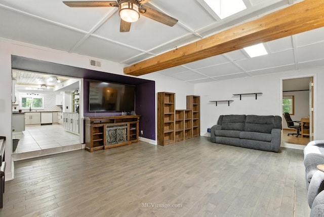 204 Wood St, Wilmington, IL 60481 - living room featuring healthy amount of natural light, hardwood / wood-style floors, ceiling fan, and beamed ceiling