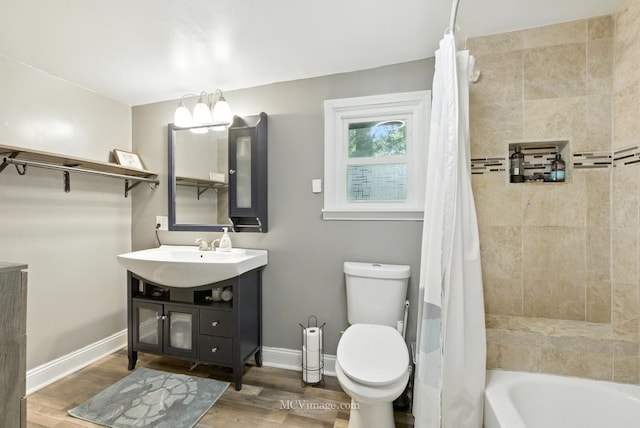 204 Wood St, Wilmington, IL 60481 - bathroom featuring vanity, wood finished floors, and shower / bath combination with curtain
