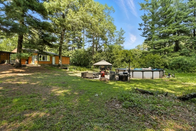 204 Wood St, Wilmington, IL 60481 - view of grassy yard featuring an outdoor pool