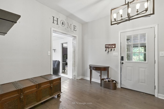 204 Wood St, Wilmington, IL 60481 - entryway featuring dark wood finished floors and a chandelier