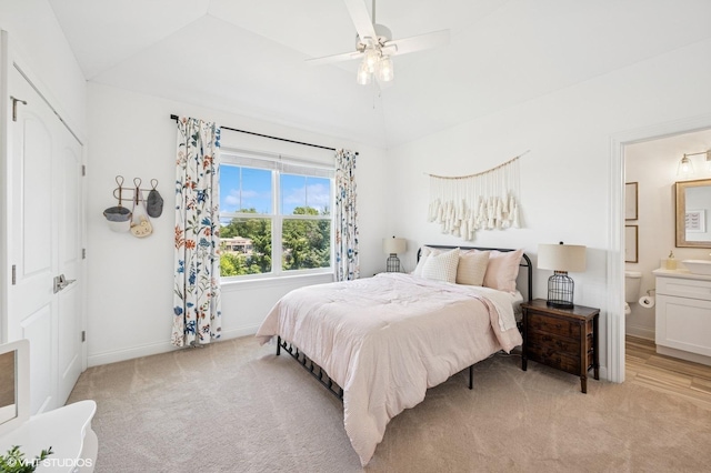 161 N Schubert St, Palatine, IL 60067 - bedroom featuring light colored carpet, connected bathroom, vaulted ceiling, and a ceiling fan