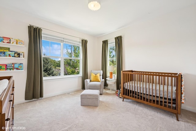 161 N Schubert St, Palatine, IL 60067 - carpeted bedroom featuring a nursery area and baseboards