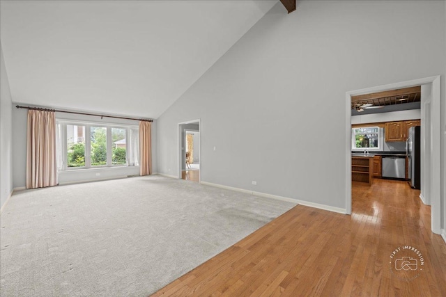 1105 W Bauer Rd, Naperville, IL 60563 - unfurnished living room featuring high vaulted ceiling, light wood finished floors, and beam ceiling
