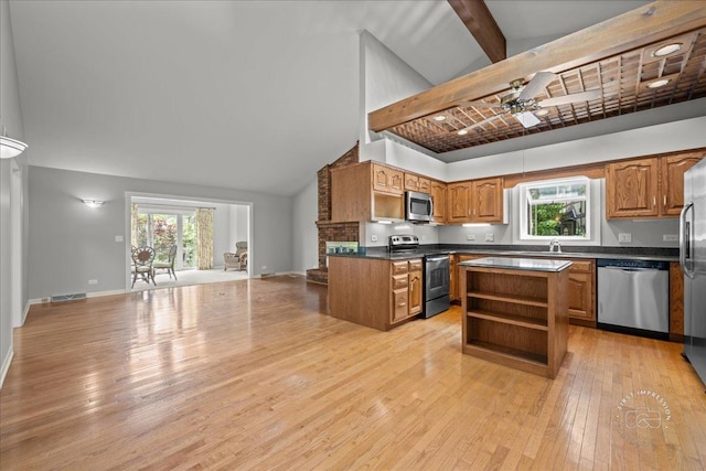 1105 W Bauer Rd, Naperville, IL 60563 - kitchen featuring stainless steel appliances, dark countertops, open floor plan, open shelves, and light wood-style floors