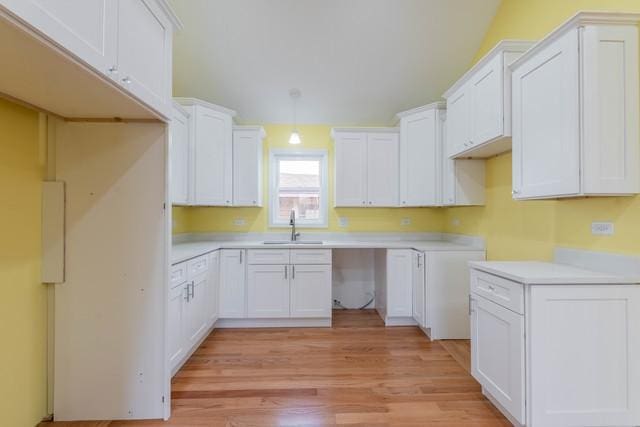 5326 W 31st St, Cicero, IL 60804 - kitchen featuring light wood-type flooring, white cabinetry, and light countertops