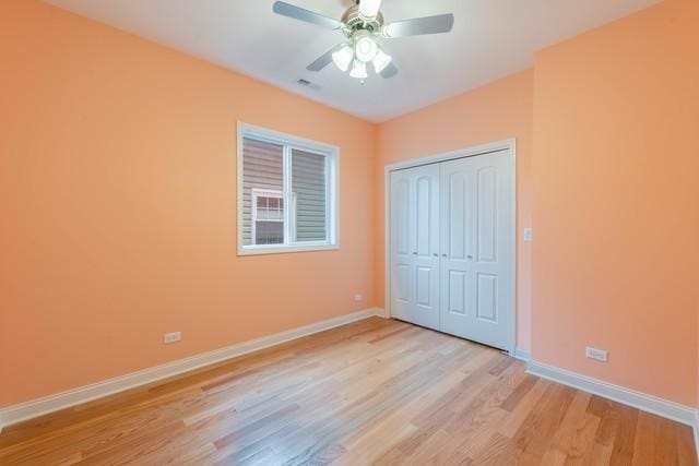 5326 W 31st St, Cicero, IL 60804 - unfurnished bedroom with light wood finished floors, a closet, and a ceiling fan
