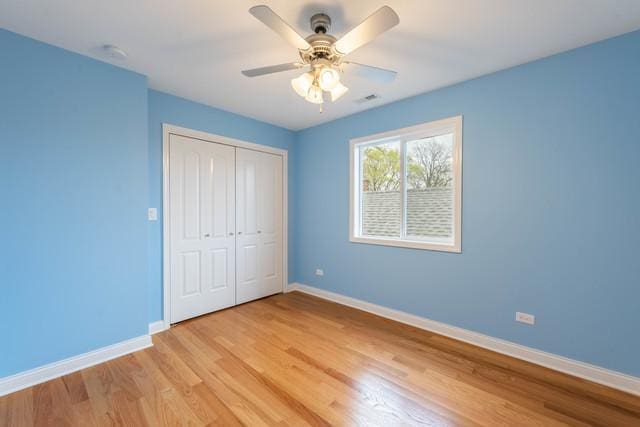 5326 W 31st St, Cicero, IL 60804 - unfurnished bedroom featuring light wood-type flooring, a closet, and ceiling fan