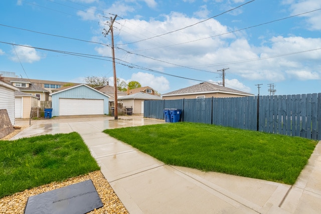 5326 W 31st St, Cicero, IL 60804 - view of yard with a detached garage and an outbuilding