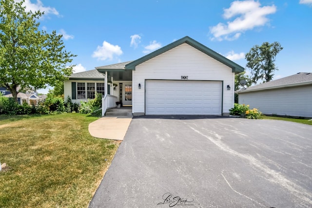 712 Hauert St, Peotone, IL 60468 - ranch-style house with a front lawn, driveway, and an attached garage