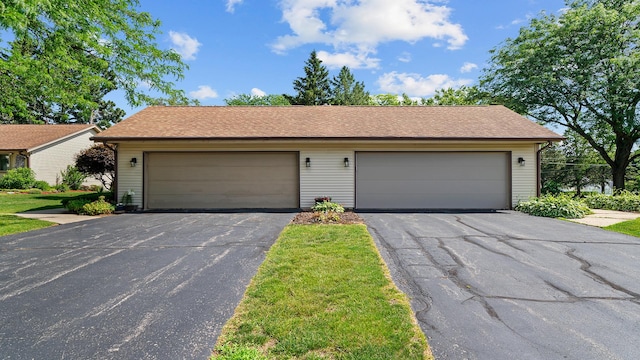 5715 Elaine Dr, Rockford, IL 61108 - view of front of property with a garage and a shingled roof