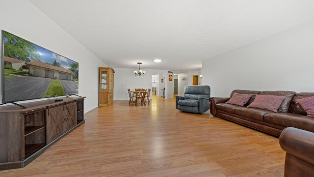5715 Elaine Dr, Rockford, IL 61108 - living area featuring a chandelier and light wood-style flooring