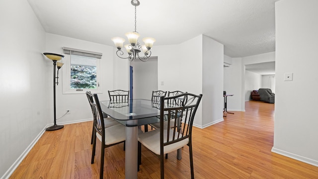 5715 Elaine Dr, Rockford, IL 61108 - dining room with light wood finished floors and a chandelier