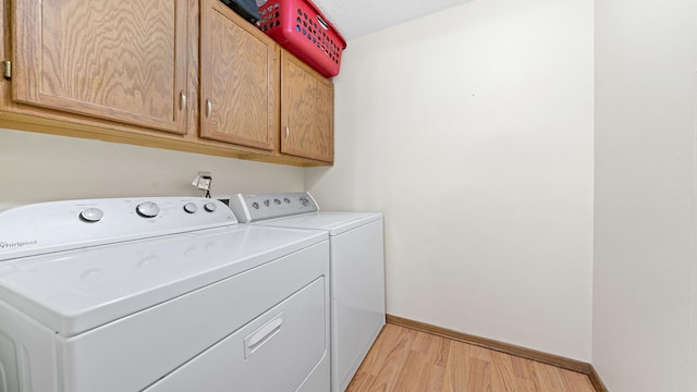 5715 Elaine Dr, Rockford, IL 61108 - washroom with separate washer and dryer, light wood-type flooring, and cabinet space