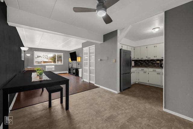 2541 Thatcher Ave Unit 2D, River Grove, IL 60171 - kitchen featuring freestanding refrigerator, ceiling fan, white cabinetry, decorative backsplash, and dark floors