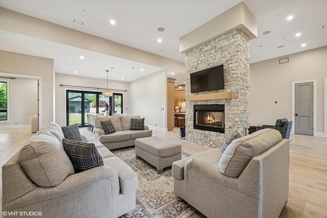 2104 Shermer Rd, Northbrook, IL 60062 - living room with light wood-type flooring, a fireplace, and recessed lighting