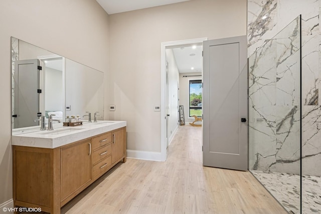 2104 Shermer Rd, Northbrook, IL 60062 - bathroom with wood finished floors, double vanity, and a marble finish shower