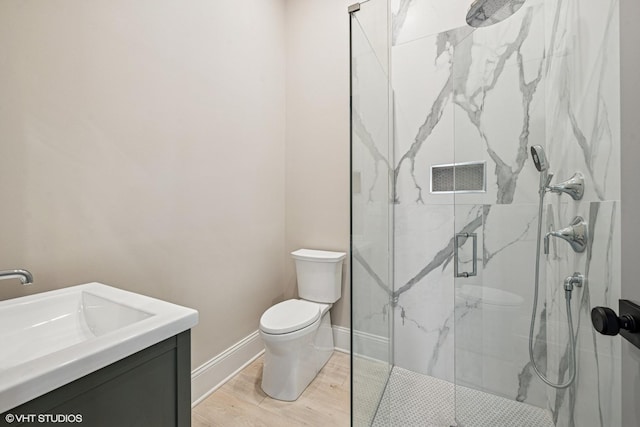 2104 Shermer Rd, Northbrook, IL 60062 - full bathroom with a marble finish shower, vanity, and wood finished floors