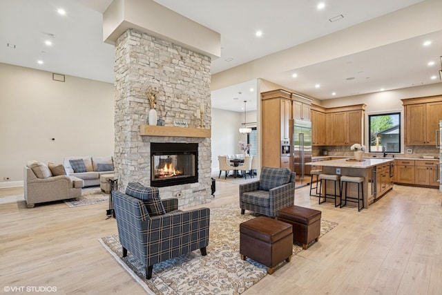 2104 Shermer Rd, Northbrook, IL 60062 - living area with light wood finished floors, a fireplace, and recessed lighting