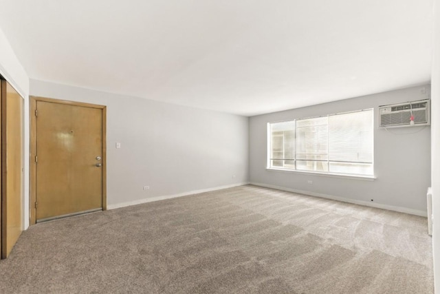 1111 N Harlem Ave Unit 1C, Oak Park, IL 60302 - spare room with a wall unit AC and carpet flooring