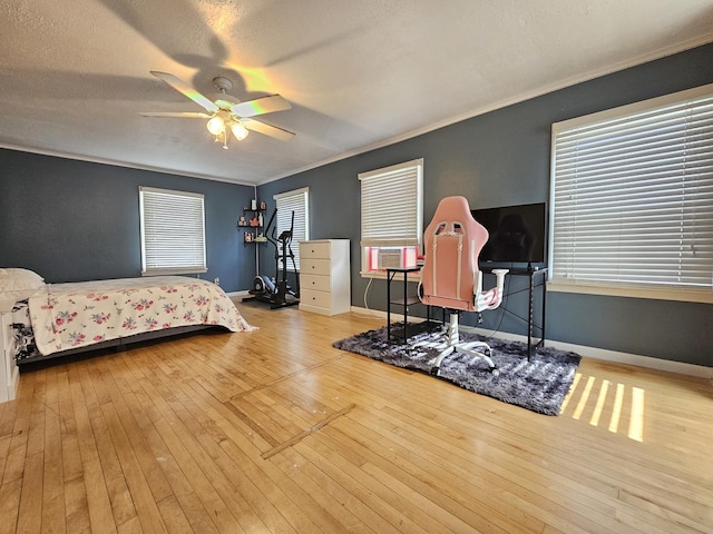 320 Congress St, Ottawa, IL 61350 - bedroom featuring wood-type flooring, ornamental molding, a ceiling fan, and a textured ceiling