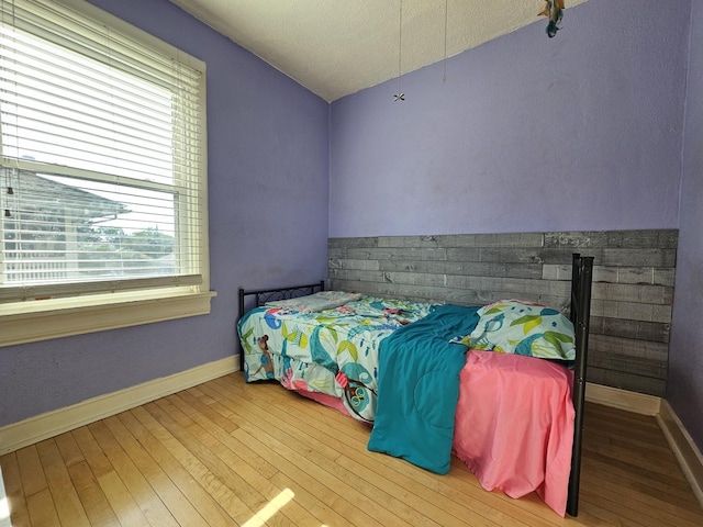 320 Congress St, Ottawa, IL 61350 - bedroom with hardwood / wood-style flooring, a textured ceiling, and vaulted ceiling