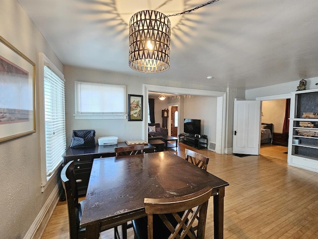 320 Congress St, Ottawa, IL 61350 - dining area with wood finished floors and a chandelier