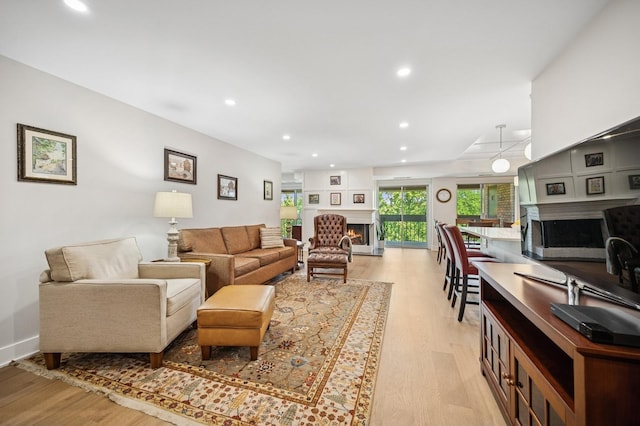 3801 Mission Hills Rd Unit 510, Northbrook, IL 60062 - living area with a warm lit fireplace, light wood-type flooring, and recessed lighting