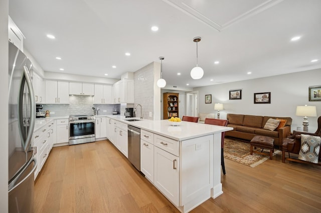 3801 Mission Hills Rd Unit 510, Northbrook, IL 60062 - kitchen with appliances with stainless steel finishes, a peninsula, light wood-style floors, open floor plan, and light countertops