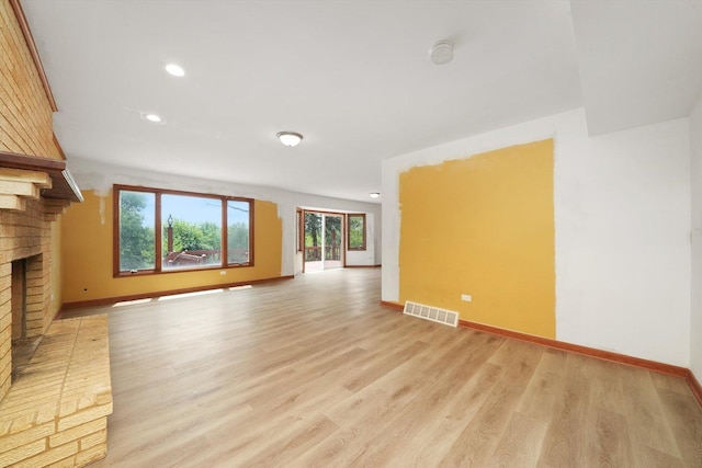3057 201st Pl, Lynwood, IL 60411 - unfurnished living room featuring a fireplace, light wood-style floors, and recessed lighting