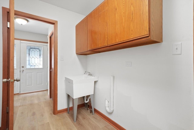 3057 201st Pl, Lynwood, IL 60411 - laundry area featuring cabinet space and light wood finished floors